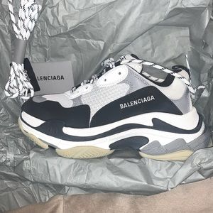 White/gray/black Triple S Balenciaga sneakers.